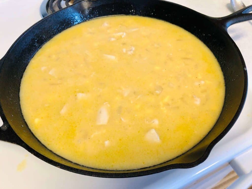 chicken and rice cooking in skillet